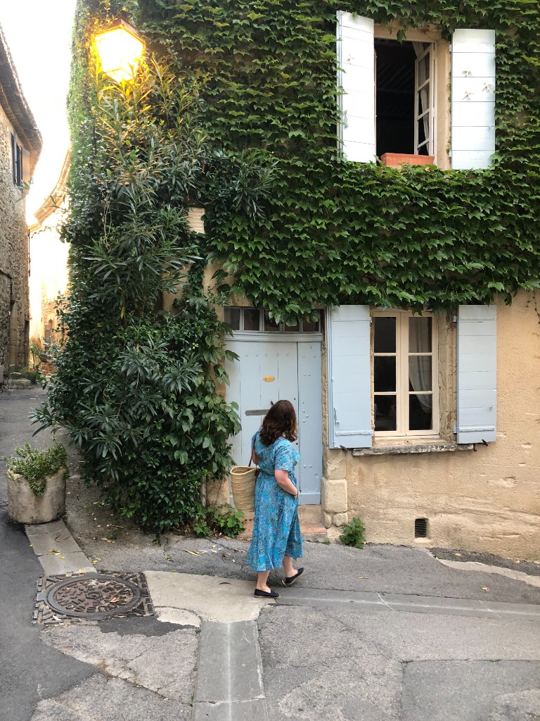 Walking toward an ivy-draped stone house in Saint-Rémy-de-Provence